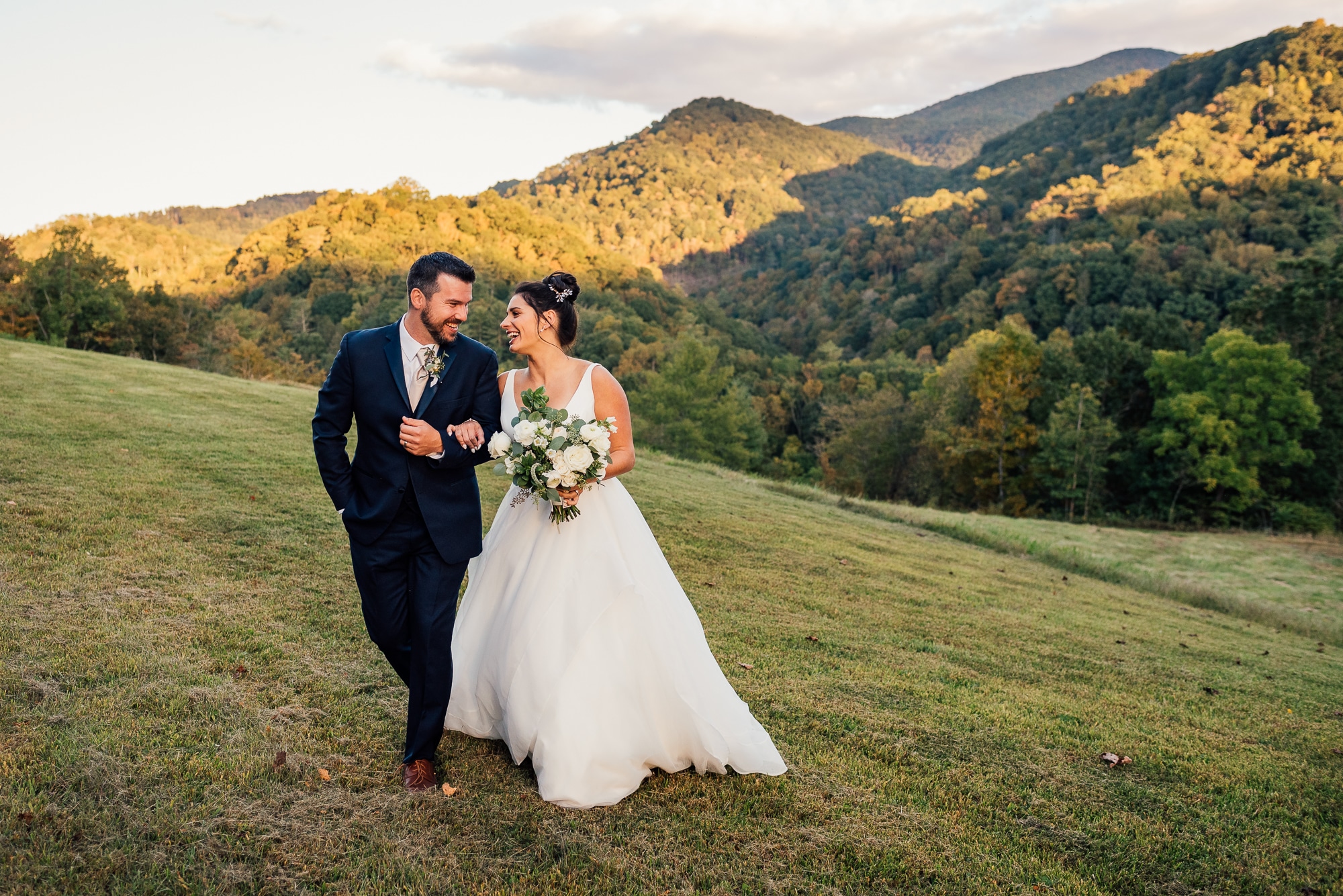 couple walking and smiling in Tennessee mountains