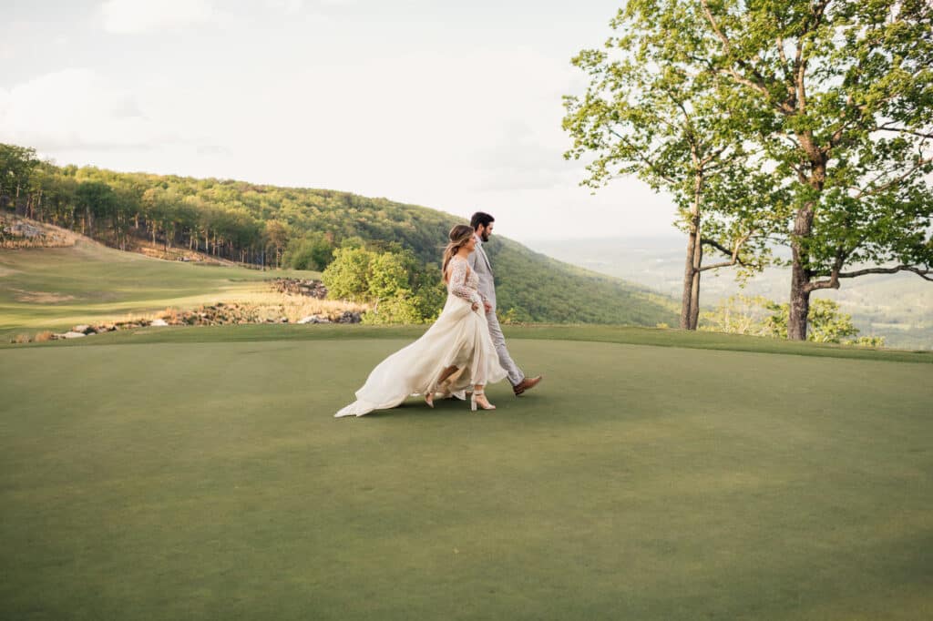 bride and groom walk across lawn at Mclemore on Lookout mountain
